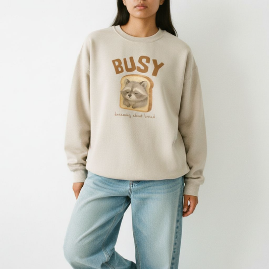 Raccoon “Busy… Dreaming About Bread” Crewneck Sweatshirt