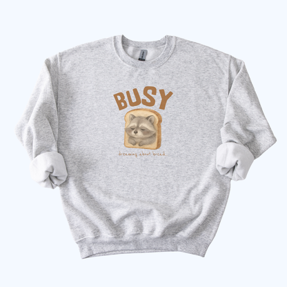 Raccoon “Busy… Dreaming About Bread” Crewneck Sweatshirt